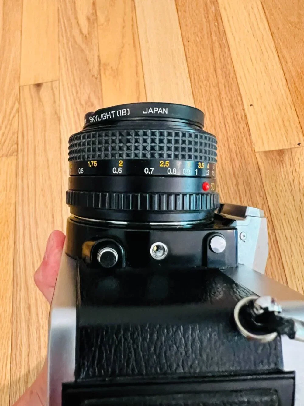 vintage Minolta XG-9 35mm SLR film camera equipped with a 50mm prime lens